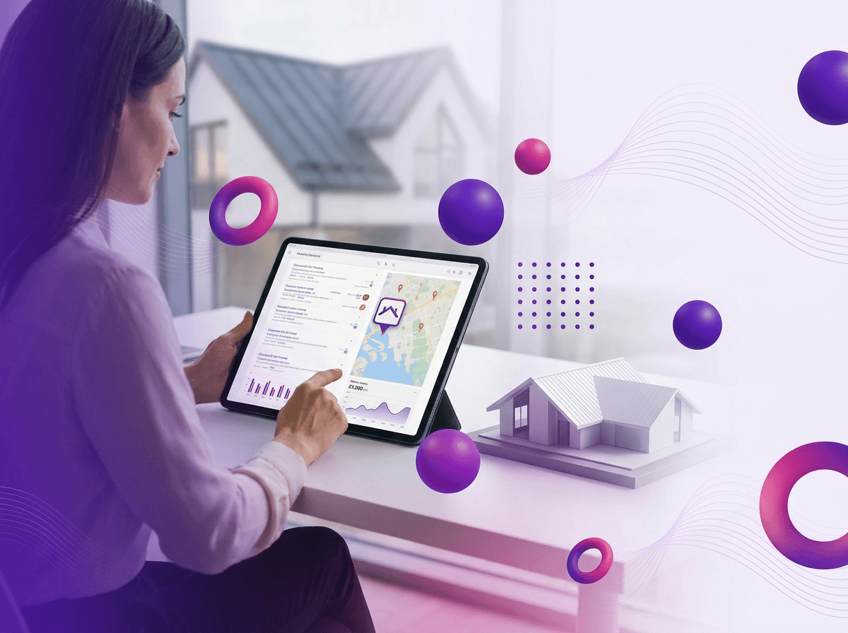 Woman reviewing market trend data and location map on tablet beside small house model on desk
